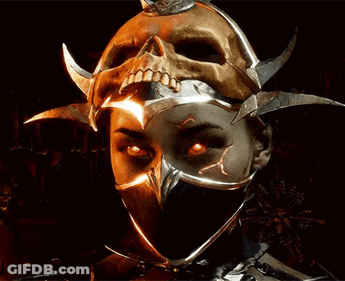 A Woman Wearing A Mask With A Skull On Top Of Her Head GIF