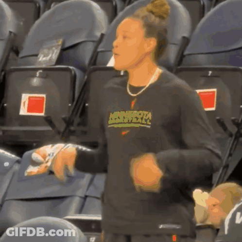 A Woman Wearing A Minnesota Basketball Shirt GIF
