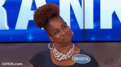 A Woman Wearing A Necklace And A Name Tag That Says Brigitte GIF