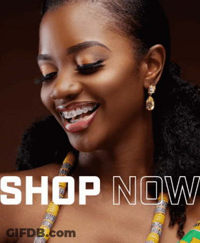 A Woman Wearing A Necklace And Earrings Is Smiling With The Words Shop Now Behind Her GIF