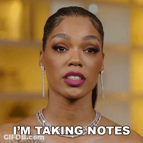 A Woman Wearing A Necklace And Earrings Is Taking Notes GIF
