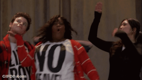A Woman Wearing A No Weave Shirt Stands Next To A Man And A Woman GIF