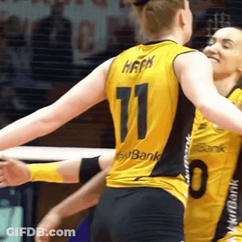 A Woman Wearing A Number 11 Jersey Is Hugging Another Woman Wearing A Number 0 Jersey GIF