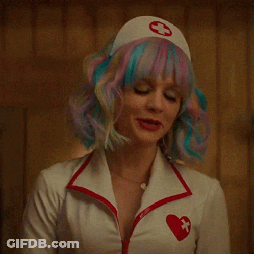 A Woman Wearing A Nurse Costume With A Red Cross On Her Hat GIF