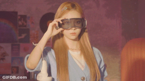 A Woman Wearing A Pair Of Virtual Reality Goggles With Gifsaesoa Written On The Bottom Right GIF