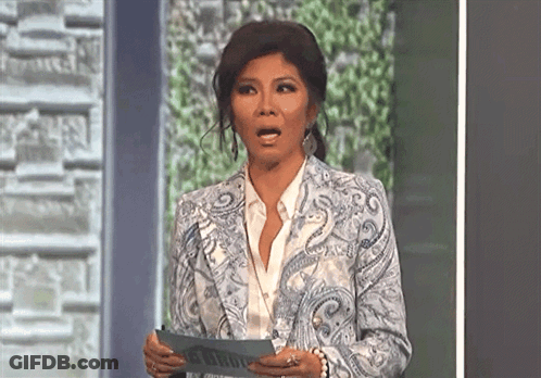 Woman In Paisley Jacket Holding Paper GIF