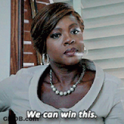 A Woman Wearing A Pearl Necklace And Earrings Says We Can Win This GIF