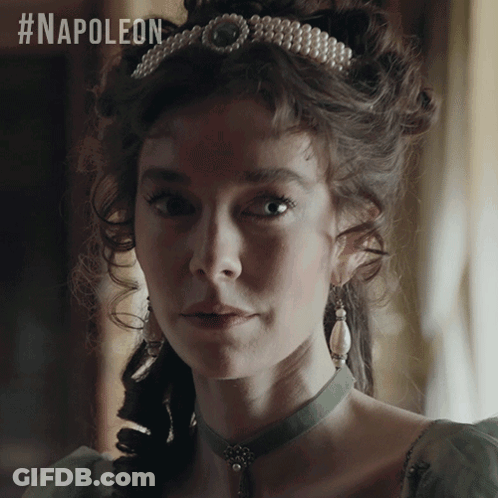A Woman Wearing A Pearl Tiara And Earrings With The #Napoleon Hashtag GIF