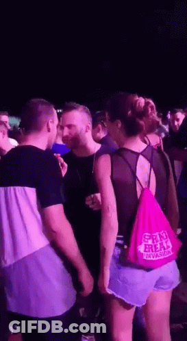 A Woman Wearing A Pink Bag That Says Shri Freak GIF