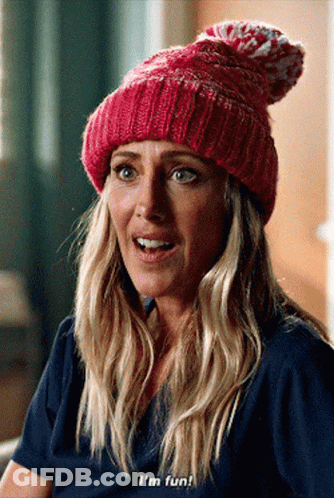 A Woman Wearing A Pink Beanie And A Blue Shirt Says I 'M Fun GIF