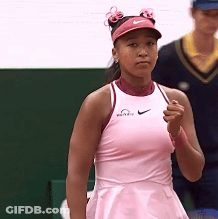 A Woman Wearing A Pink Dress And A Pink Nike Visor GIF
