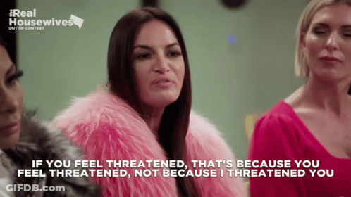 A Woman Wearing A Pink Fur Coat Says If You Feel Threatened GIF