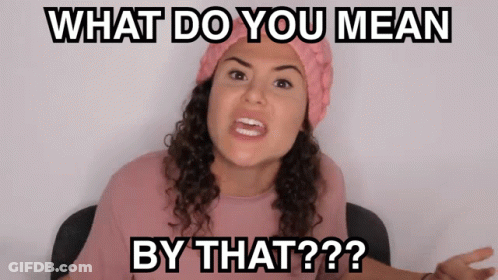 A Woman Wearing A Pink Hat And A Pink Shirt Says What Do You Mean By That GIF