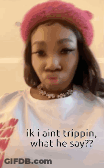 A Woman Wearing A Pink Hat And A White Shirt With The Words `` Ik I Aint Trippin , What He Say '' . GIF