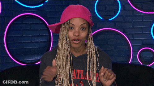 A Woman Wearing A Pink Hat And An Atlanta Sweatshirt GIF