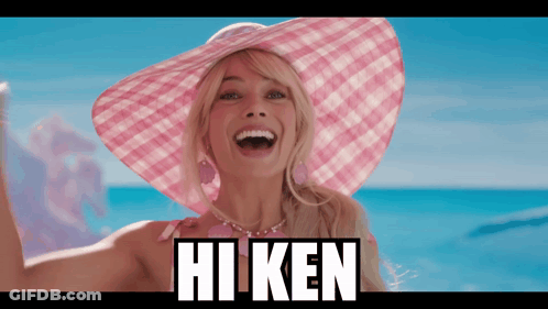 A Woman Wearing A Pink Hat With The Word Hi Ken On The Bottom GIF