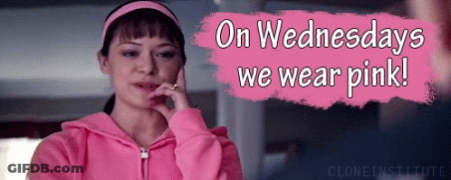 A Woman Wearing A Pink Hoodie Is Talking On A Cell Phone GIF