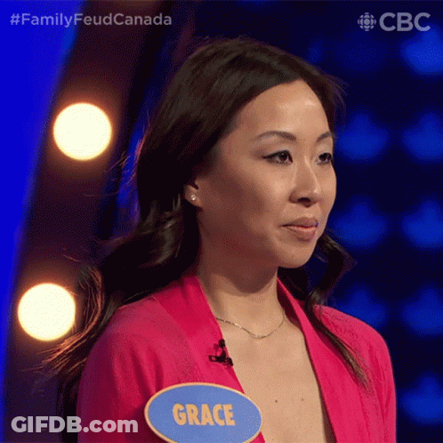 A Woman Wearing A Pink Shirt And A Name Tag That Says Grace GIF