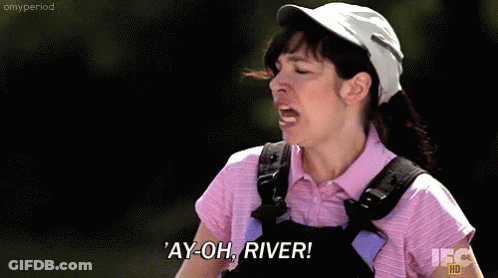 A Woman Wearing A Pink Shirt And Overalls Is Screaming ' Ay-Oh River ' GIF