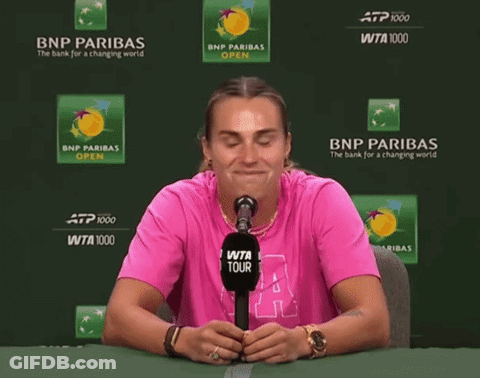 A Woman Wearing A Pink Shirt With The Letter A On It GIF