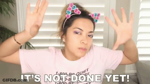 A Woman Wearing A Pink Shirt With The Words It 'S Not Done Yet Written On It GIF