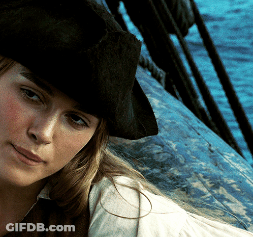 A Woman Wearing A Pirate Hat Is Looking At The Camera GIF