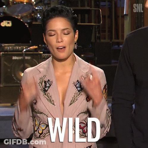A Woman Wearing A Plunging Jacket With The Word Wild Written On It GIF