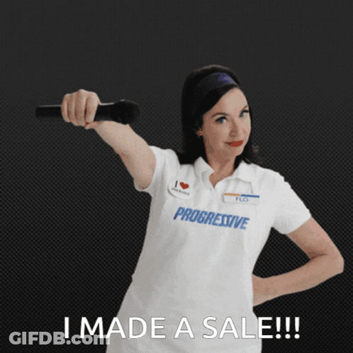 A Woman Wearing A Progressive Shirt Holds A Microphone GIF