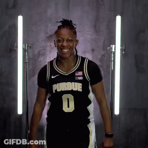 A Woman Wearing A Purdue Jersey Number 0 GIF