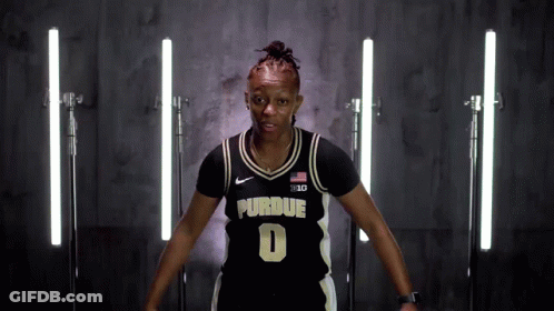 A Woman Wearing A Purdue Jersey With The Number 0 On It GIF