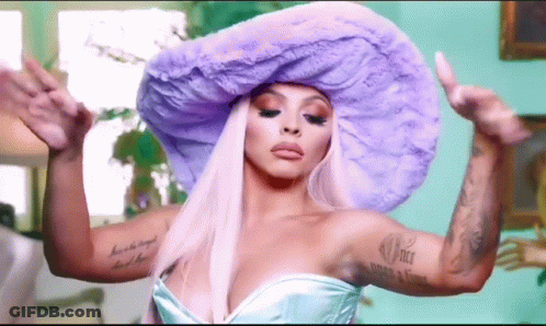 A Woman Wearing A Purple Hat And A Blue Dress . GIF