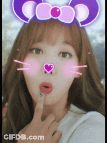 A Woman Wearing A Purple Headband With A Heart On It GIF