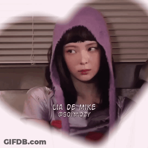 A Woman Wearing A Purple Hoodie With Lia De Mike @Soymidzy Written On The Bottom GIF