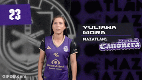 A Woman Wearing A Purple Jersey With The Number 23 GIF