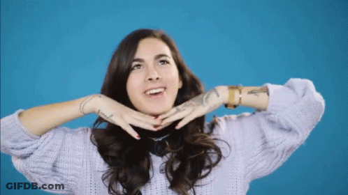 A Woman Wearing A Purple Sweater Has A Tattoo On Her Wrist That Says ' I Love You ' GIF