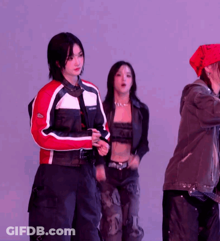 A Woman Wearing A Red And White Jacket With The Word Lacoste On The Front GIF