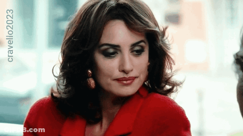 A Woman Wearing A Red Coat Has The Year 2023 On The Bottom Right GIF