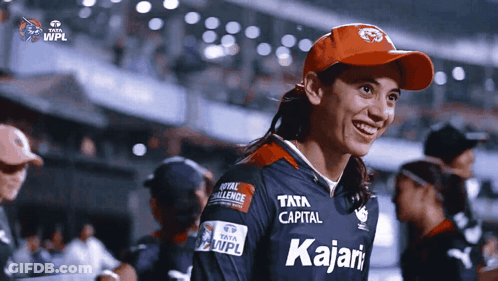 A Woman Wearing A Red Hat And A Jersey That Says Kajari GIF