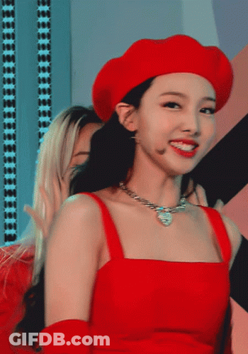 A Woman Wearing A Red Hat And A Red Top GIF