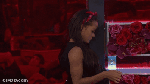 A Woman Wearing A Red Headband That Says ' I Love You ' GIF