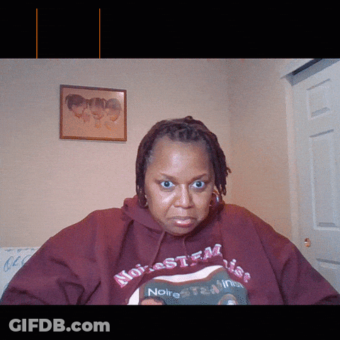 A Woman Wearing A Red Hoodie That Says Noire GIF