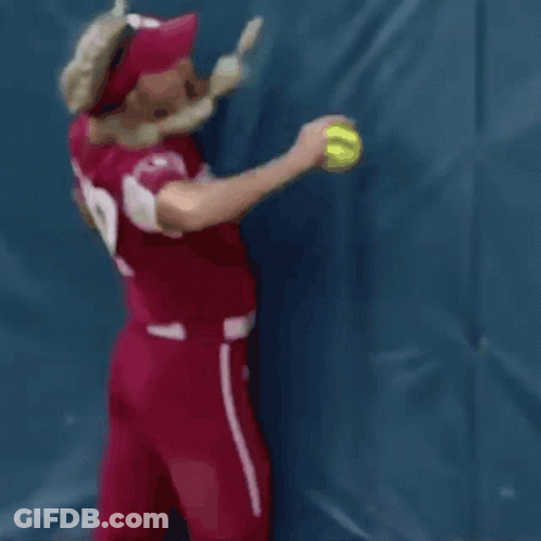 A Woman Wearing A Red Jersey With The Number 12 On It GIF