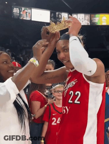 A Woman Wearing A Red Jersey With The Number 22 GIF