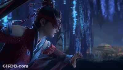 A Woman Wearing A Red Mask And A Red Dress Is Standing In Front Of A Blue Wall . GIF
