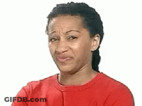 A Woman Wearing A Red Shirt Is Making A Funny Face . GIF