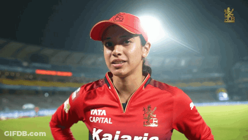 A Woman Wearing A Red Shirt That Says " Kalaria " On It GIF