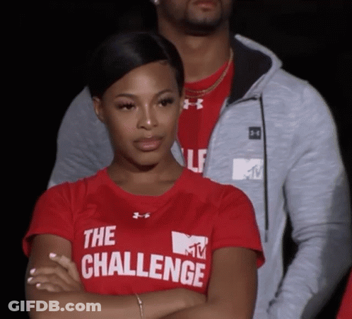 A Woman Wearing A Red Shirt That Says The Challenge On It GIF