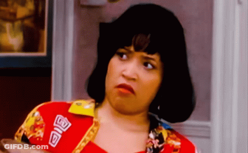 A Woman Wearing A Red Shirt With A Patch That Says ' A ' On It GIF