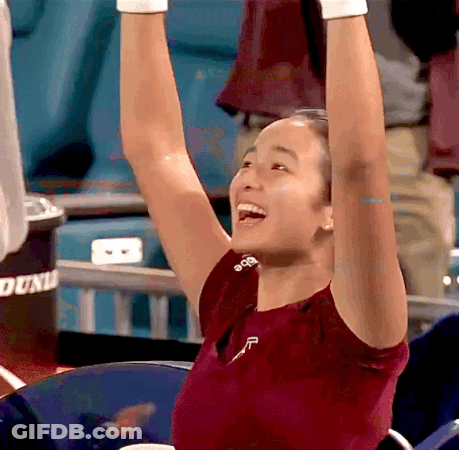 A Woman Wearing A Red Shirt With The Letter F On It GIF