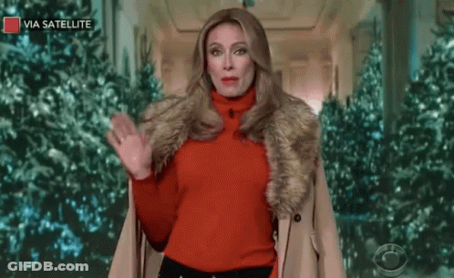 A Woman Wearing A Red Sweater And A Fur Coat Says " Vazia Queridinho " GIF